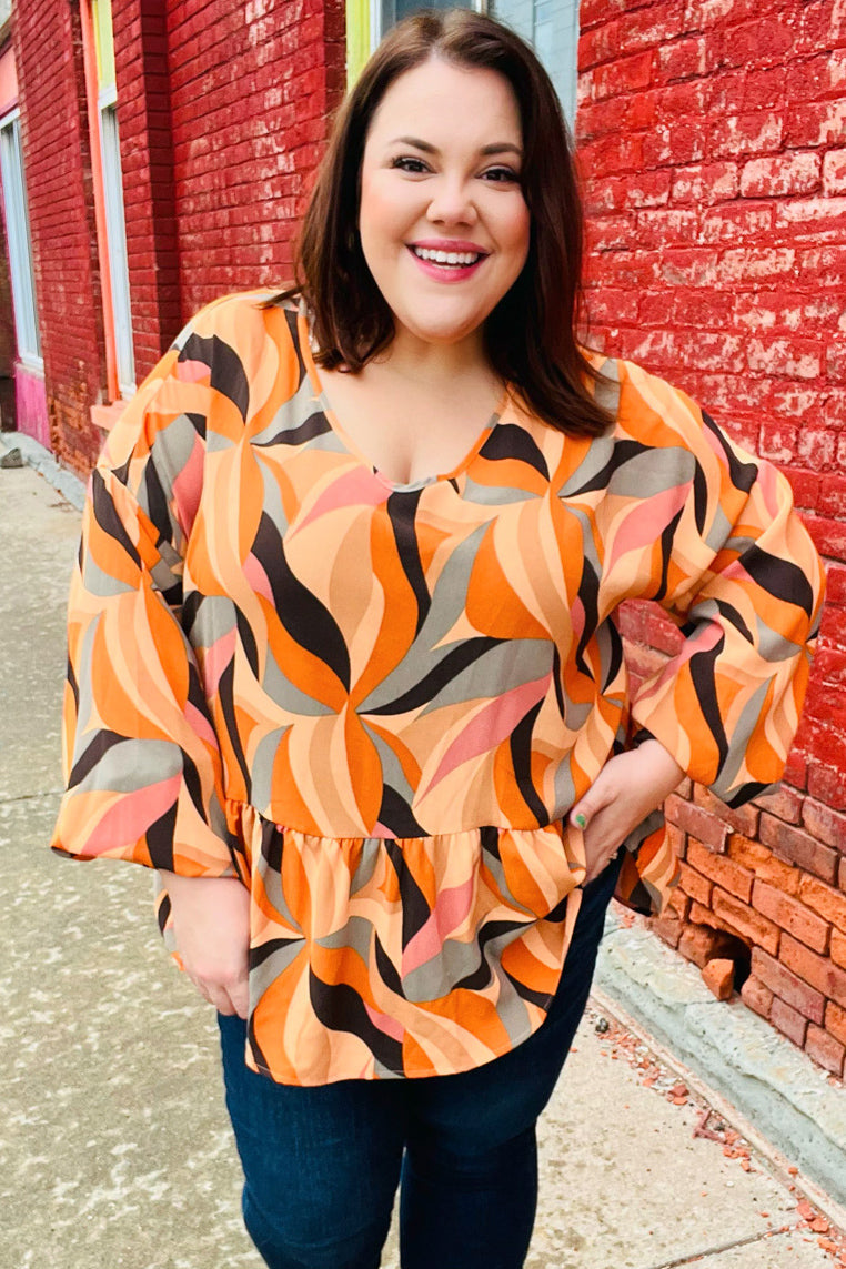 Rust Abstract Print V Neck Peplum Top