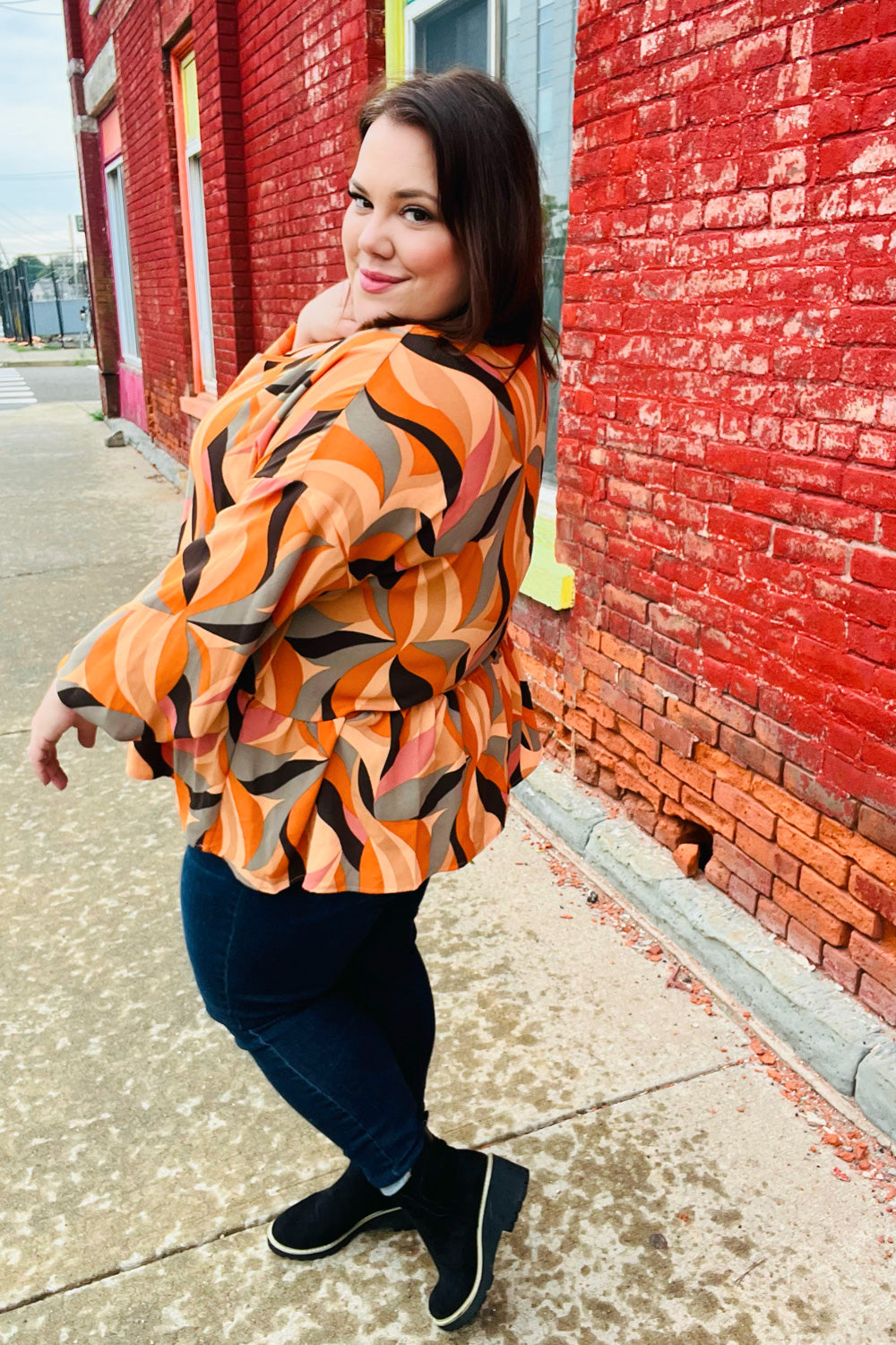 Rust Abstract Print V Neck Peplum Top