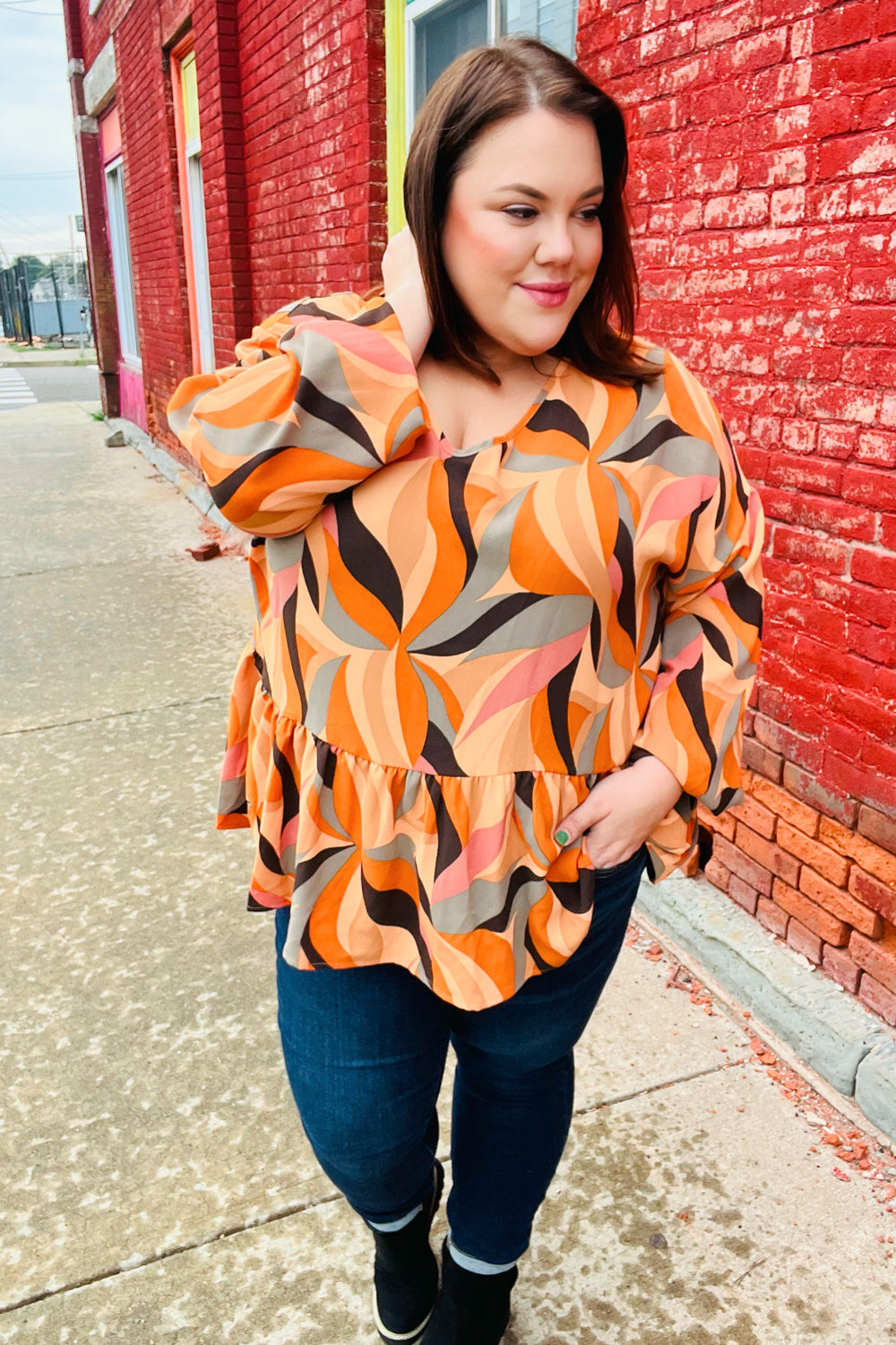 Rust Abstract Print V Neck Peplum Top