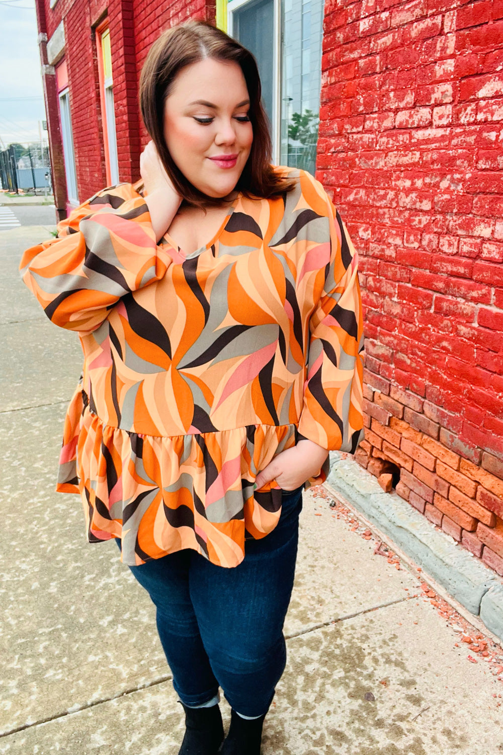 Rust Abstract Print V Neck Peplum Top