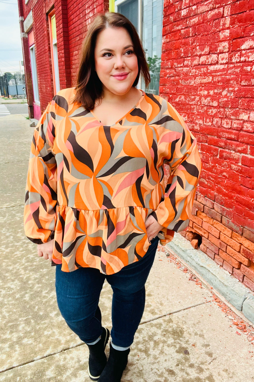 Rust Abstract Print V Neck Peplum Top