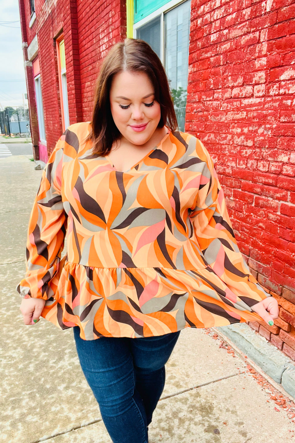 Rust Abstract Print V Neck Peplum Top